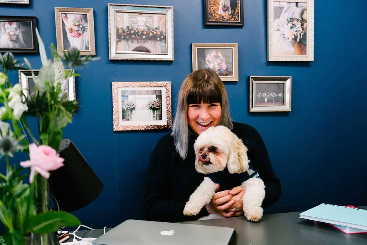 Successful Business Betty Bluebell - Emma and her dog Ted at her work space at Storage Vault