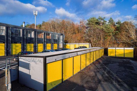 Exterior view of Storage Vault self storage units in Livingston East with yellow doors