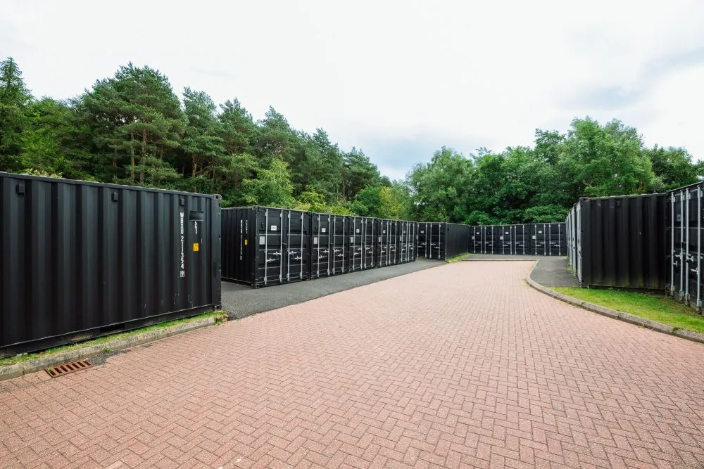 Drive-up container storage units in Livingston West with brick-paved access