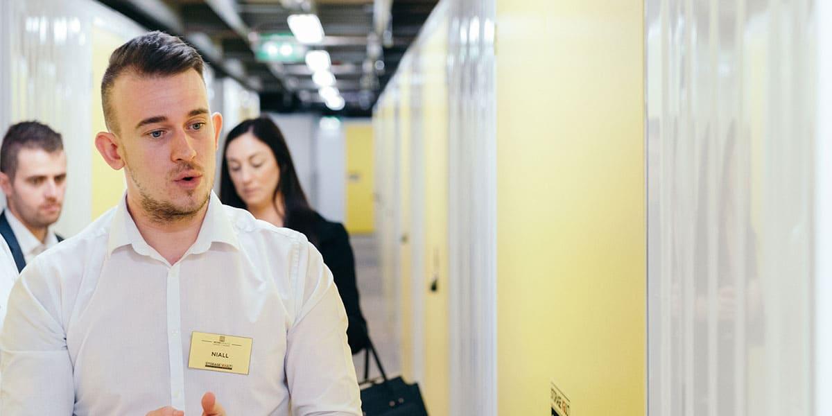 Staff showing moving house storage units